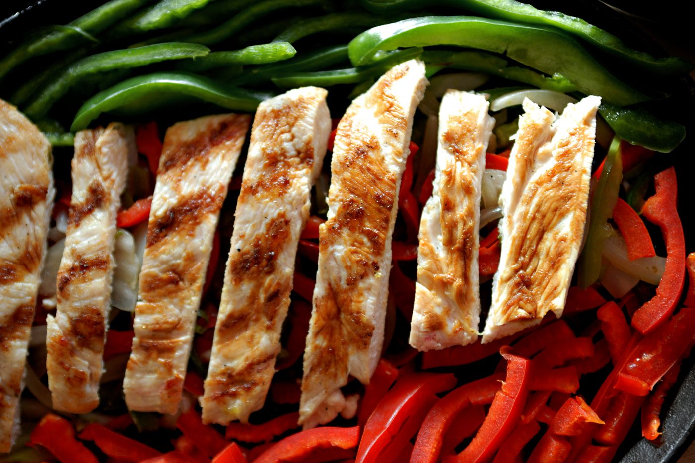 Sizzling chicken fajitas with peppers and onions in Ormond Beach, FL